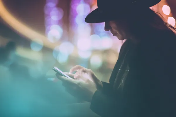 A confident dealer surrounded by casino chips inviting players to access their KKFB account, reflecting quick and easy login options.